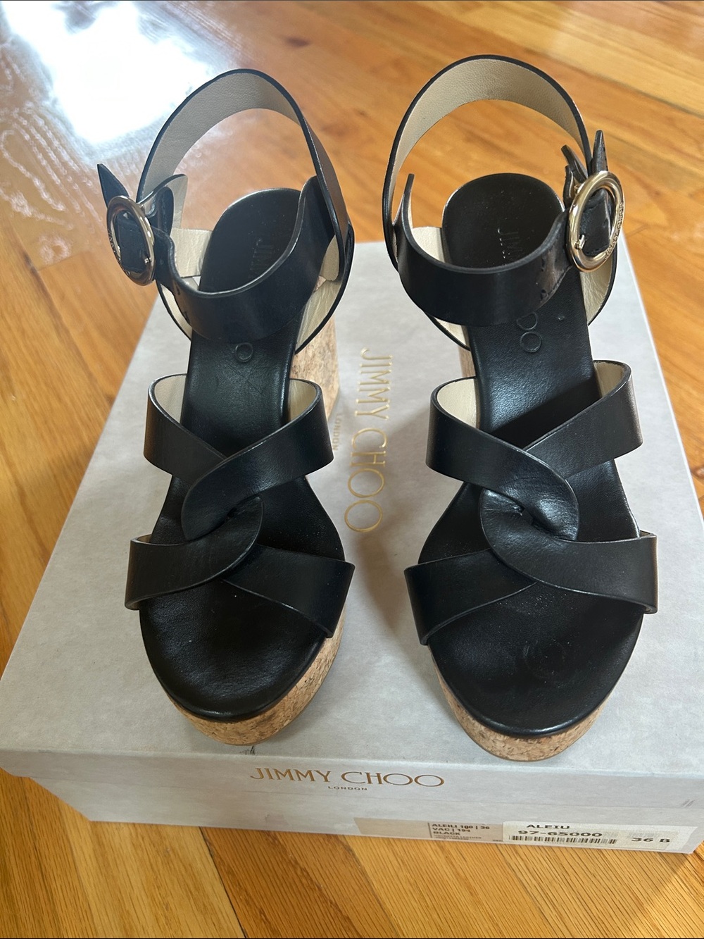 Jimmy Choo Black Leather Cork Wedge Sandals with Gold Buckle Accent